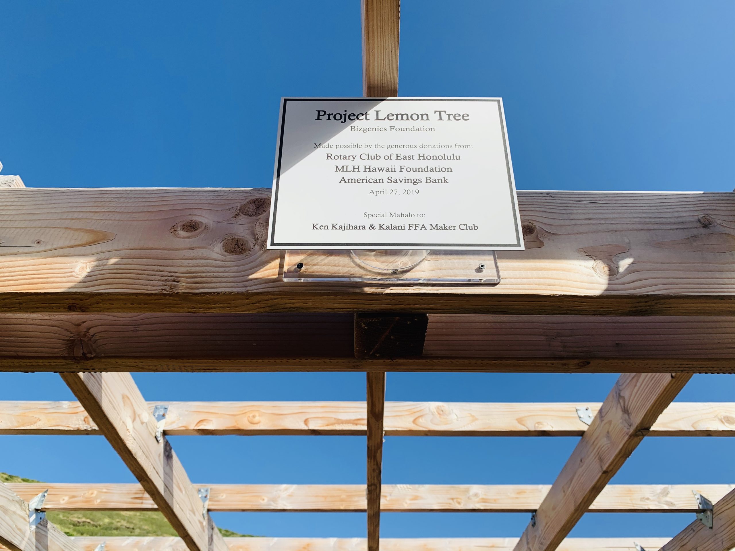 Sponsor dedication sign on the Kalani High School Project Lemon Tree pergola | Bizgenics Foundation